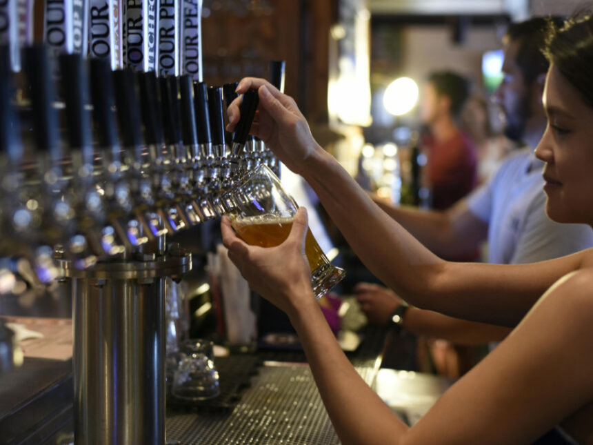 Bartender pouring a draught beer