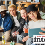 Four younger LDA consumers posing for a selfie holding drinks