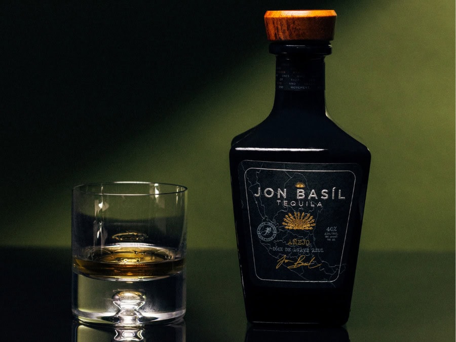 Bottle of Jon Basil Añejo tequila with a short serve