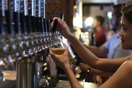 Bartender pouring a draught beer