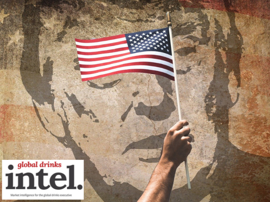 American flag against backdrop of mural of Donald Trump