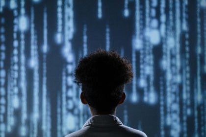 A child standing in front of a digital screen