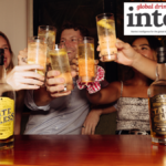 Drinkers with two bottles of Stateless American whiskey