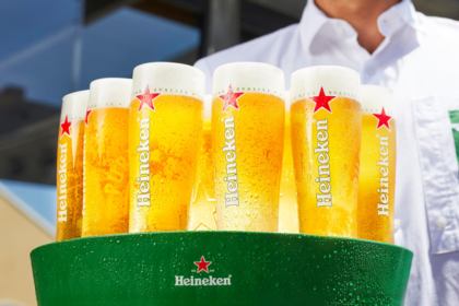Branded glasses of Heineken on a tray