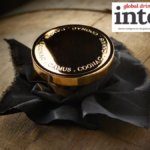 Gold Camus-branded stopper in a barrel