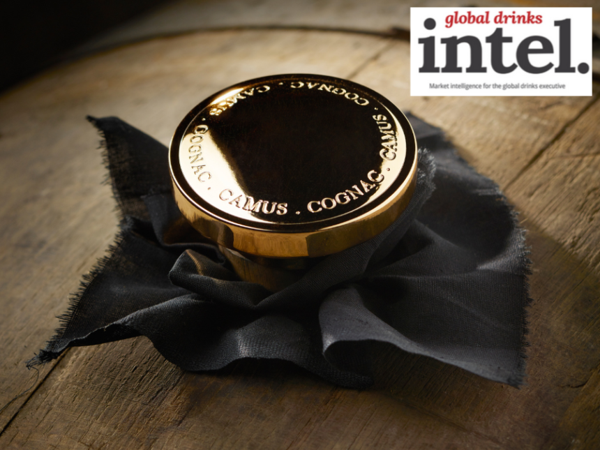 Gold Camus-branded stopper in a barrel