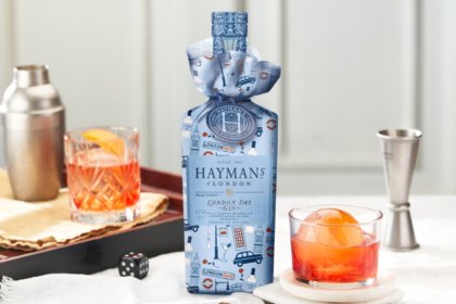 Wrapped bottle of Hayman's Gin with a negroni serve