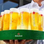 Branded glasses of Heineken on a tray