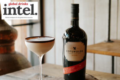 Bottle of Cotswolds Cream Liqueur with a flat white martini cocktail serve