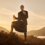 Harrison Ford in Scottish highlands with Glenmorangie whisky bottle and glass