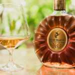 Rémy Martin bottle next to glass