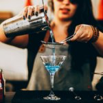 Bartender pouring a cocktail