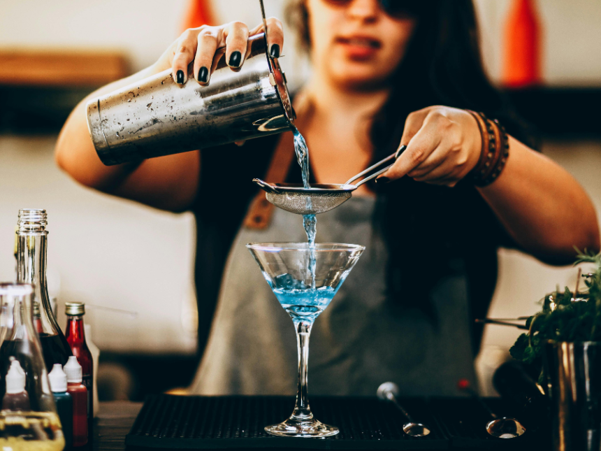 Bartender pouring a cocktail