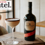 Bottle of Cotswolds Cream Liqueur with a flat white martini cocktail serve