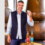 Kevin Pietersen with bottles of Dram Bell blended scotch whisky