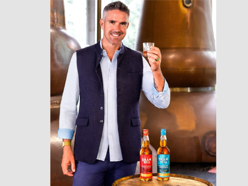 Kevin Pietersen with bottles of Dram Bell blended scotch whisky