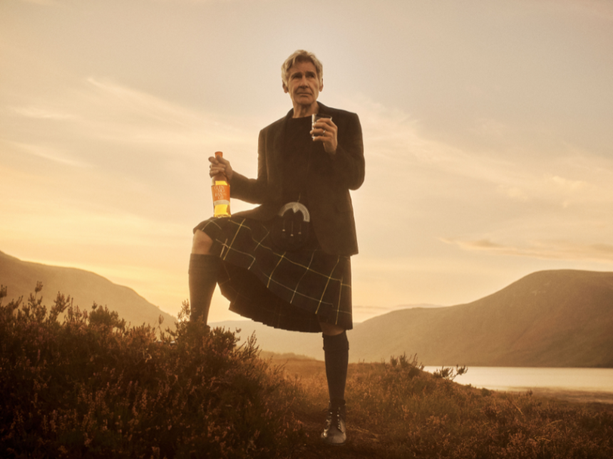 Harrison Ford in Scottish highlands with Glenmorangie whisky bottle and glass