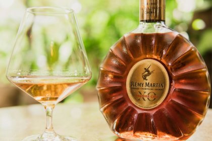 Rémy Martin bottle next to glass