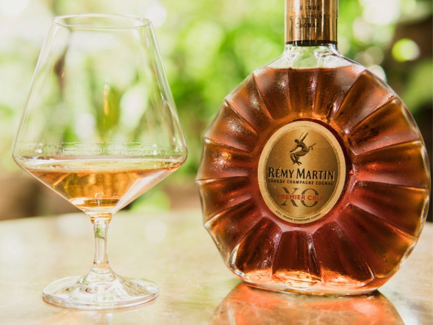 Rémy Martin bottle next to glass