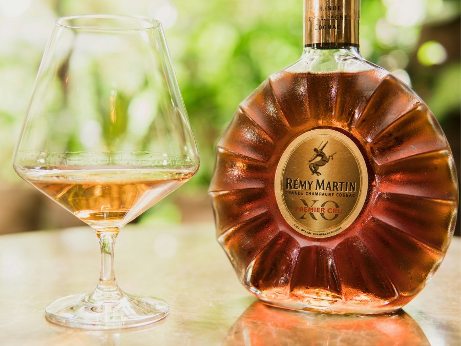 Rémy Martin bottle next to glass