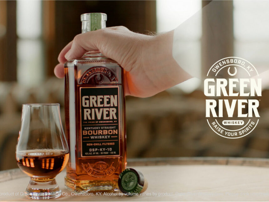 Green River whiskey bottle held by ghost's hand next to serve