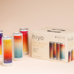 Four Hiyo cans next to box