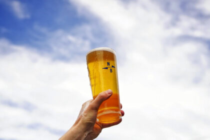 Branded glass of North Brewing beer