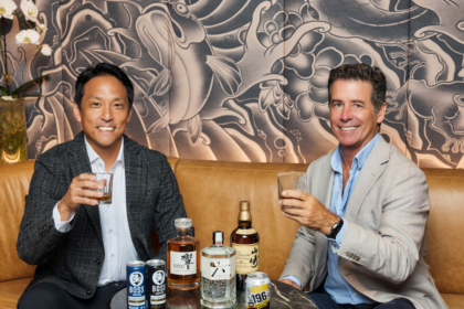 Incoming CEO Daisuke Minato next to departing CEO Darren Fullerton