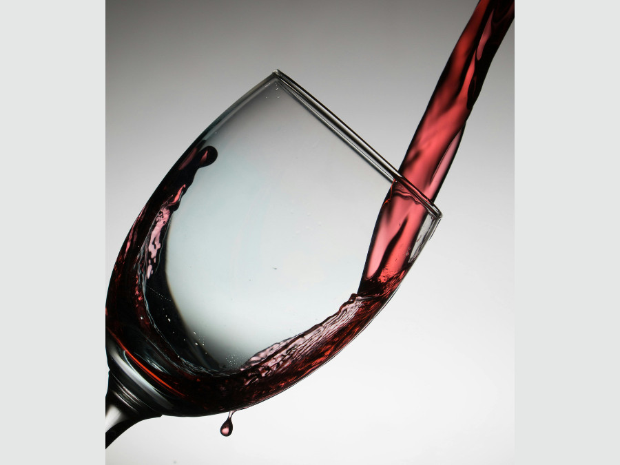 Red wine being poured into a glass