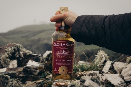 Clonakilty Irish whiskey bottle being held