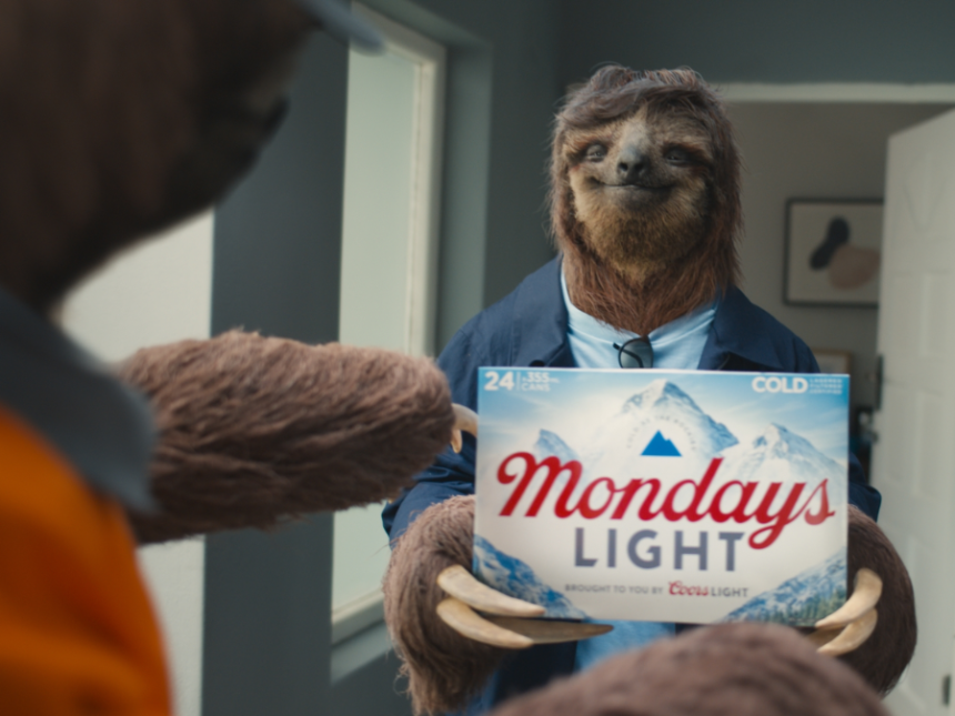 A sloth holds limited edition Coors Light case of beer in advert