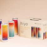 Four Hiyo cans next to box