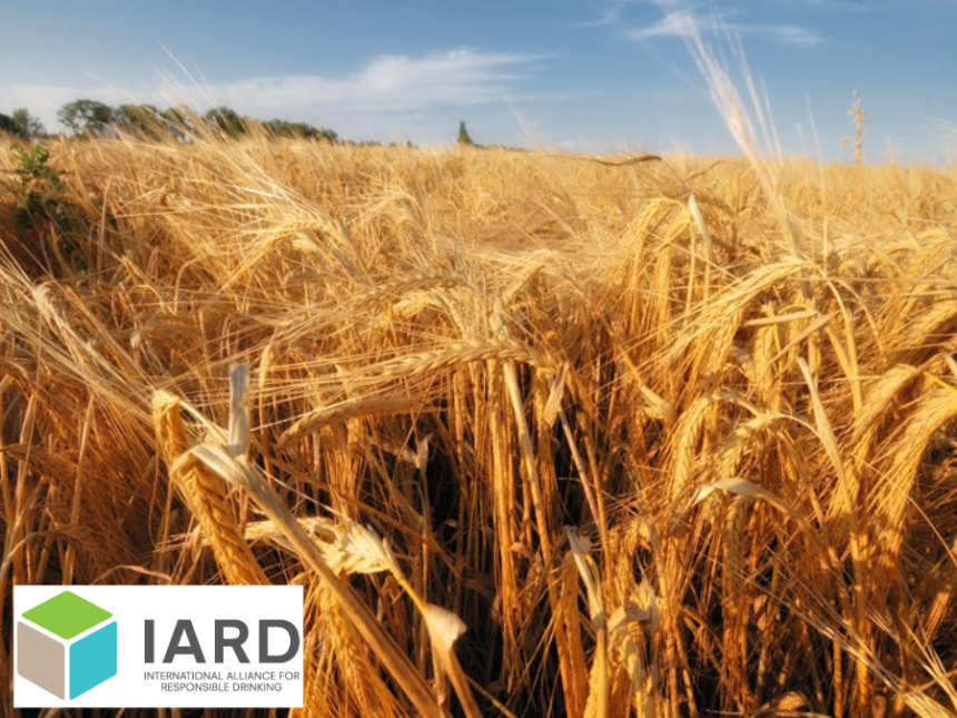 A field of barley plus the logo for IARD
