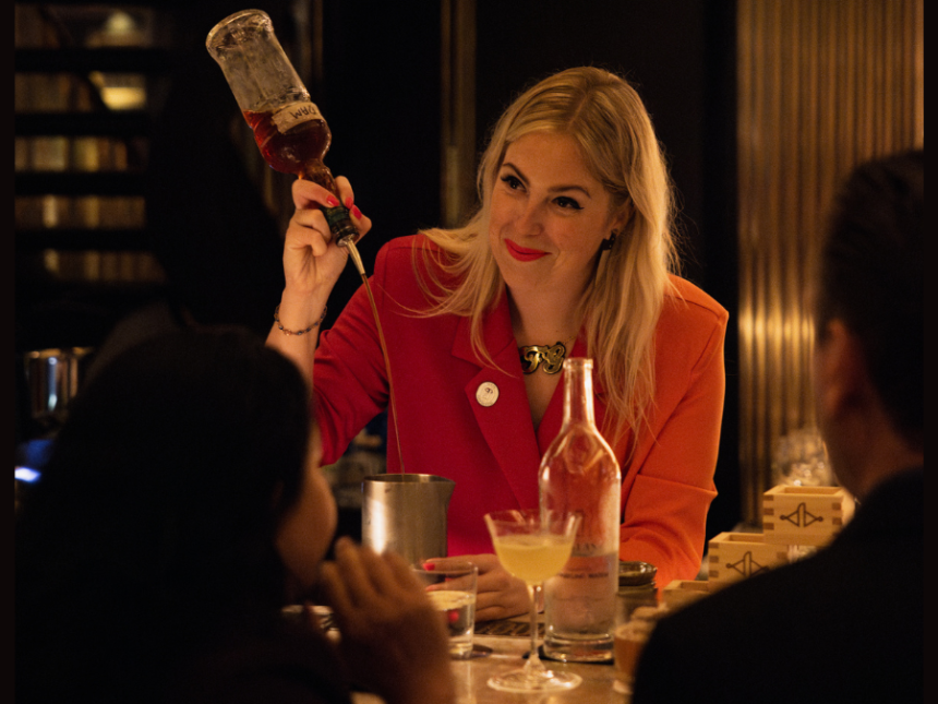Holly Graham preparing a cocktail in a bar