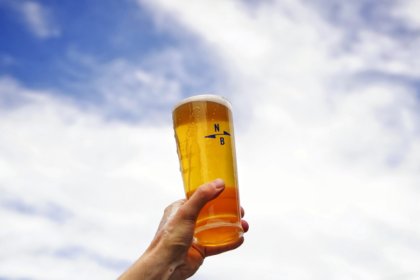 Branded glass of North Brewing beer