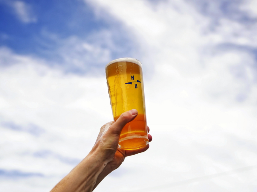 Branded glass of North Brewing beer