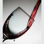 Red wine being poured into a glass