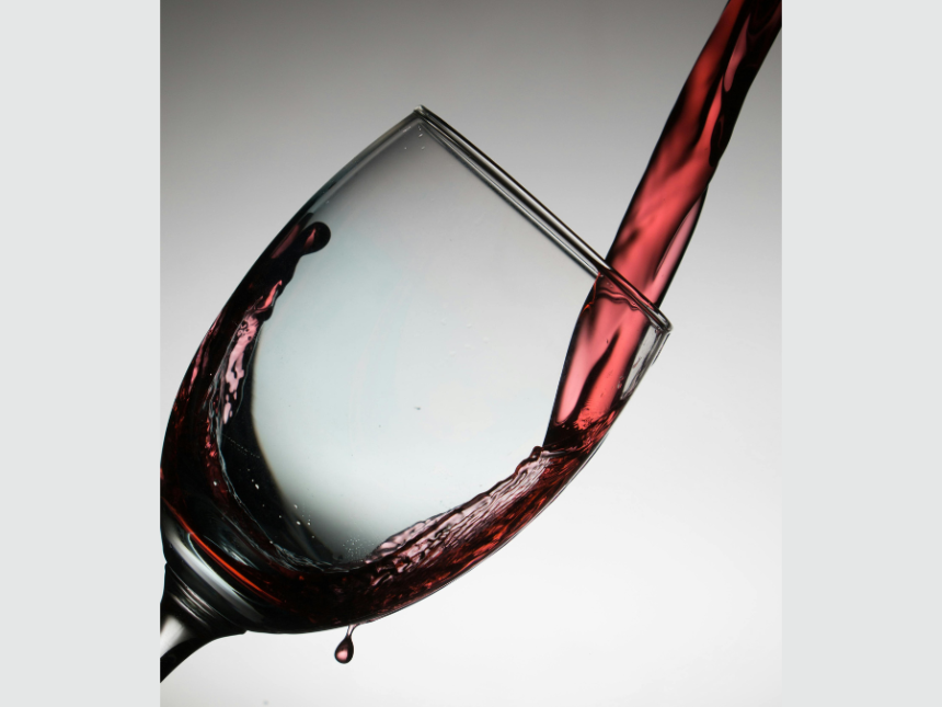 Red wine being poured into a glass