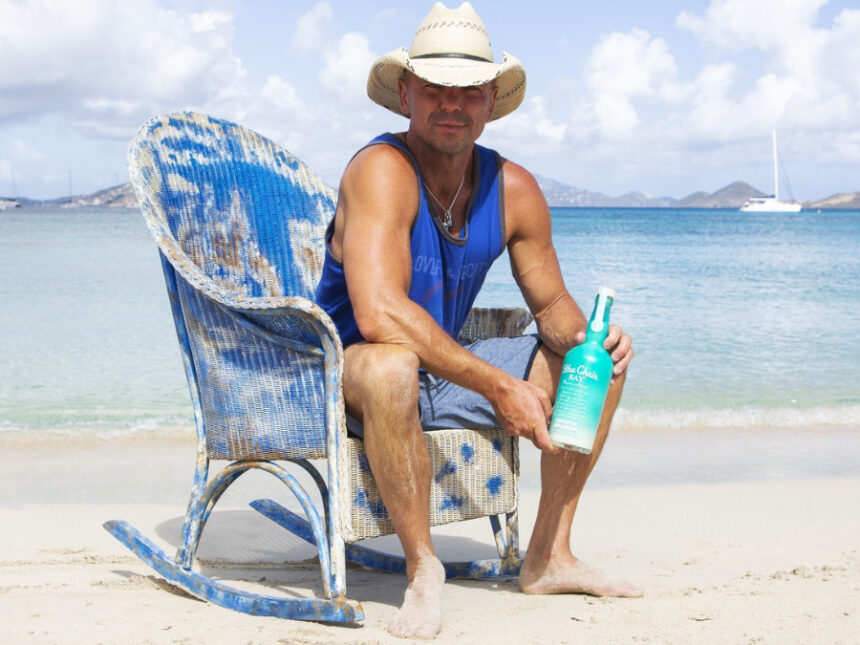 Kenny Chesney with a bottle of Blue Chair Bay Rum