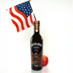 Dutch Barn vodka bottle with US flag and an apple
