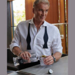 Dolph Lundgren with bottle of Hard Cut Vodka