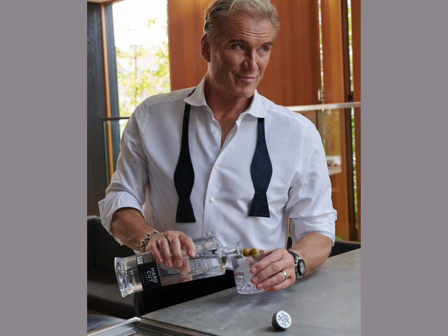 Dolph Lundgren with bottle of Hard Cut Vodka