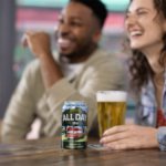 All Day IPA can with serve and two consumers