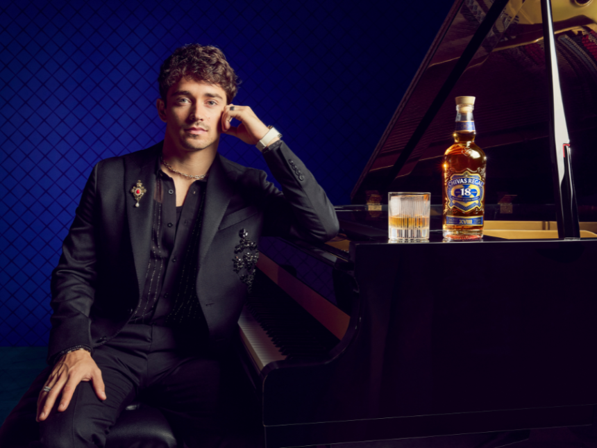 Charles Leclerc next to piano with Chivas Regal bottle and serve