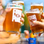 Fourpure pints in glasses clinking