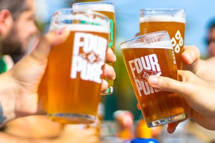 Fourpure pints in glasses clinking