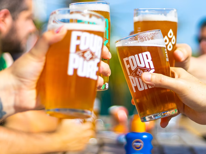 Fourpure pints in glasses clinking