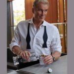 Dolph Lundgren with bottle of Hard Cut Vodka