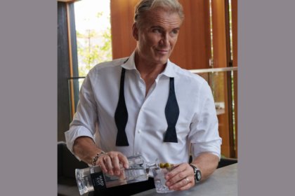 Dolph Lundgren with bottle of Hard Cut Vodka