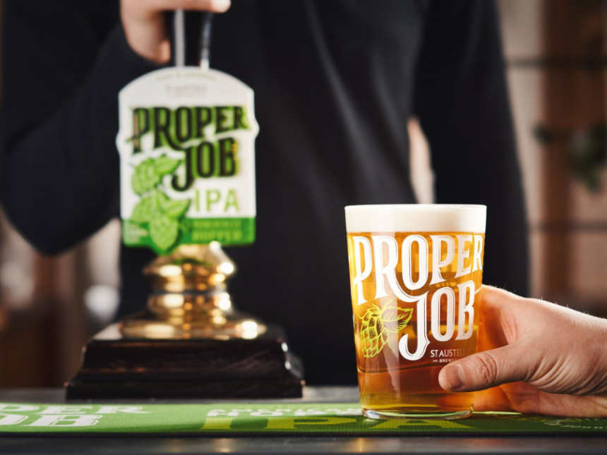 Proper Job IPA pint serve next to tap